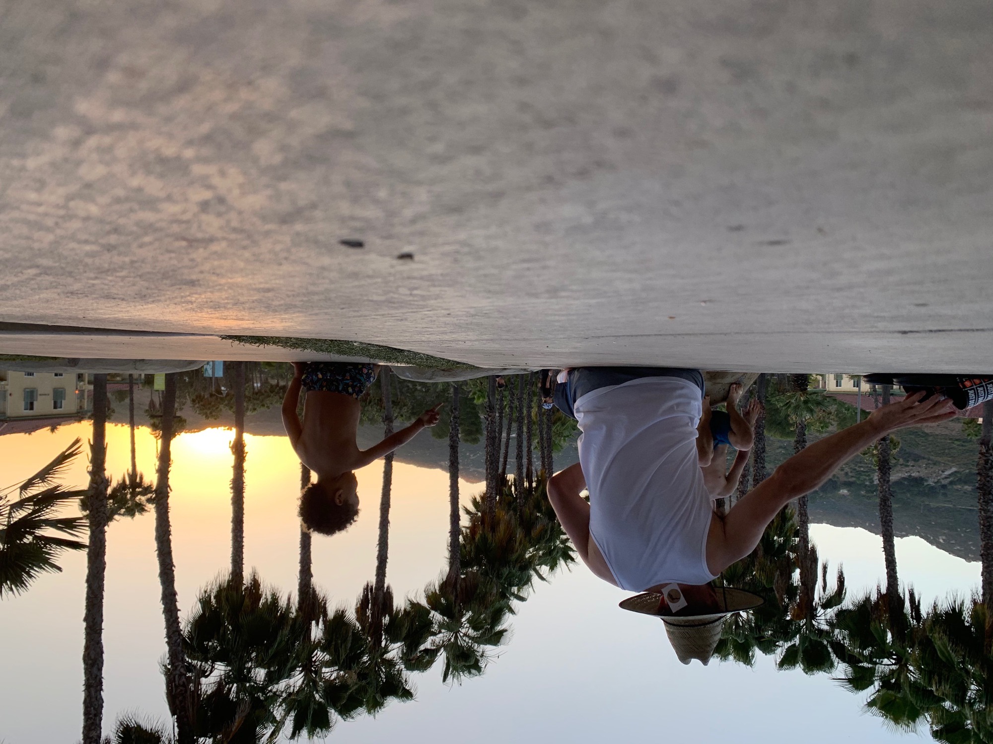Dad and kid at sunset