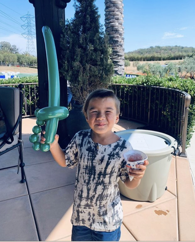 Boy with balloon sword